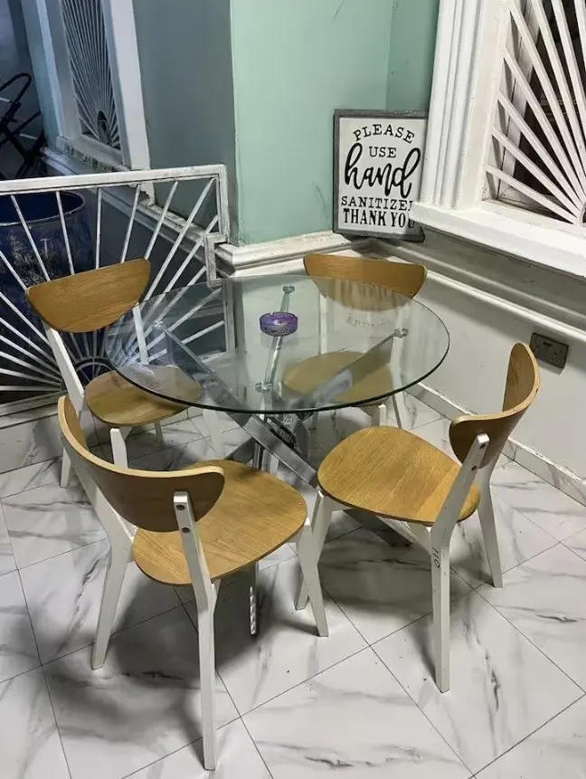 Cozy dining nook with a round glass table