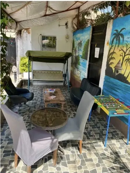 Covered porch with seating and games table